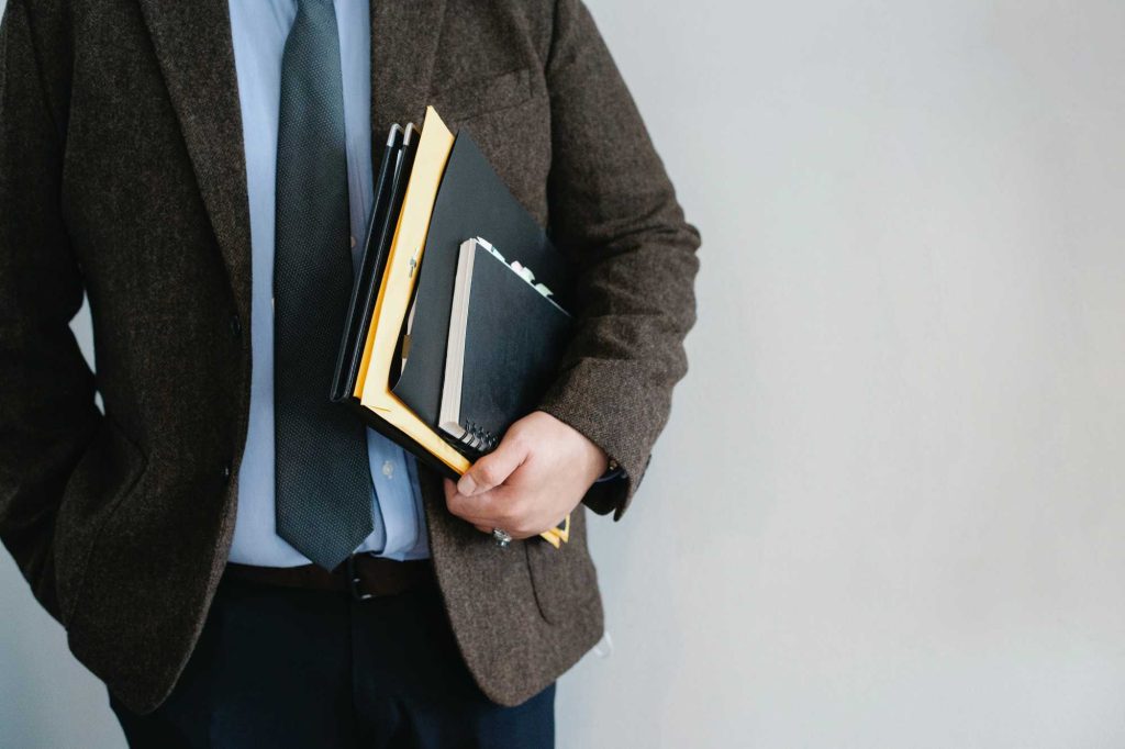 Man in suit with clipboard