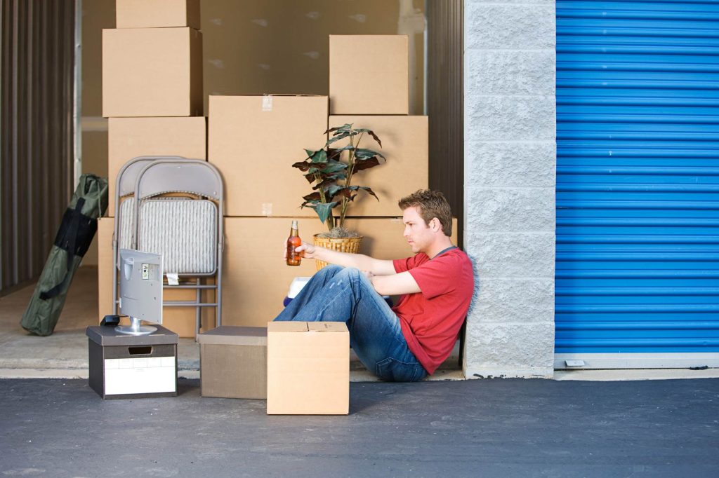 Man trying to fill storage unit alone