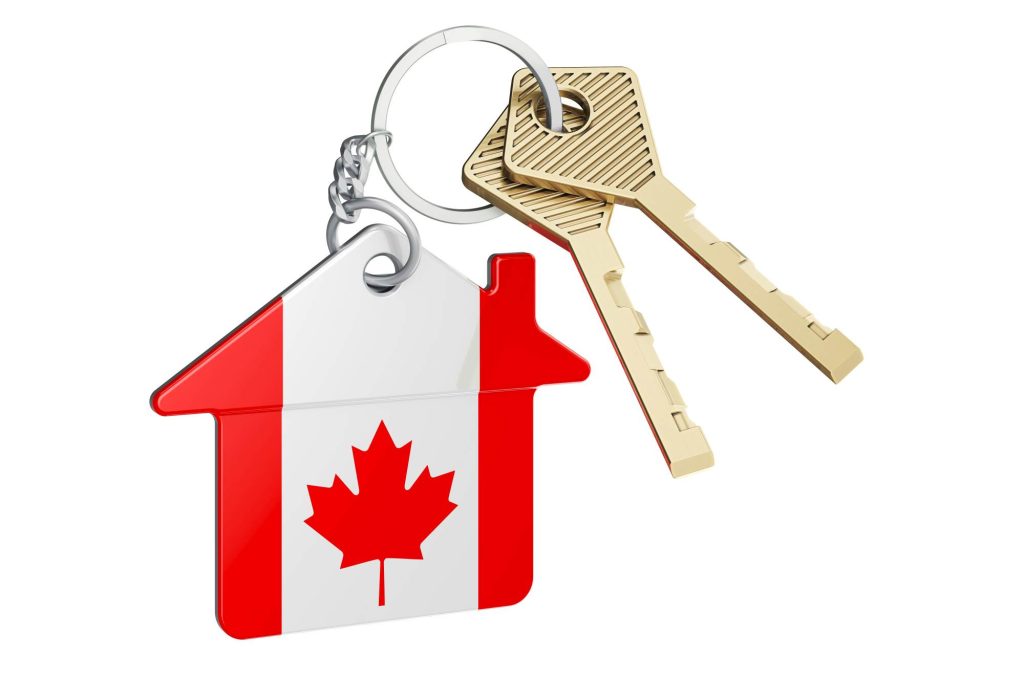Real estate in Canada. Home keychain with Canadian flag. Propert